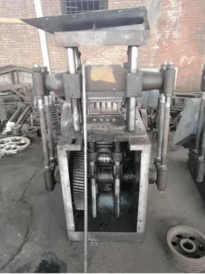 Close‑up detail of unpainted honeycomb coal briquette press machine